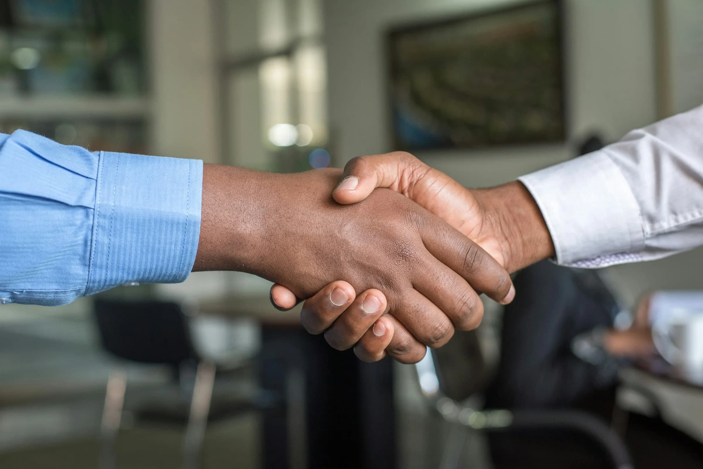 Two professionals in a focused advisory conversation